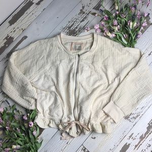 Really cute cream cotton zip up with ruffle bottom
